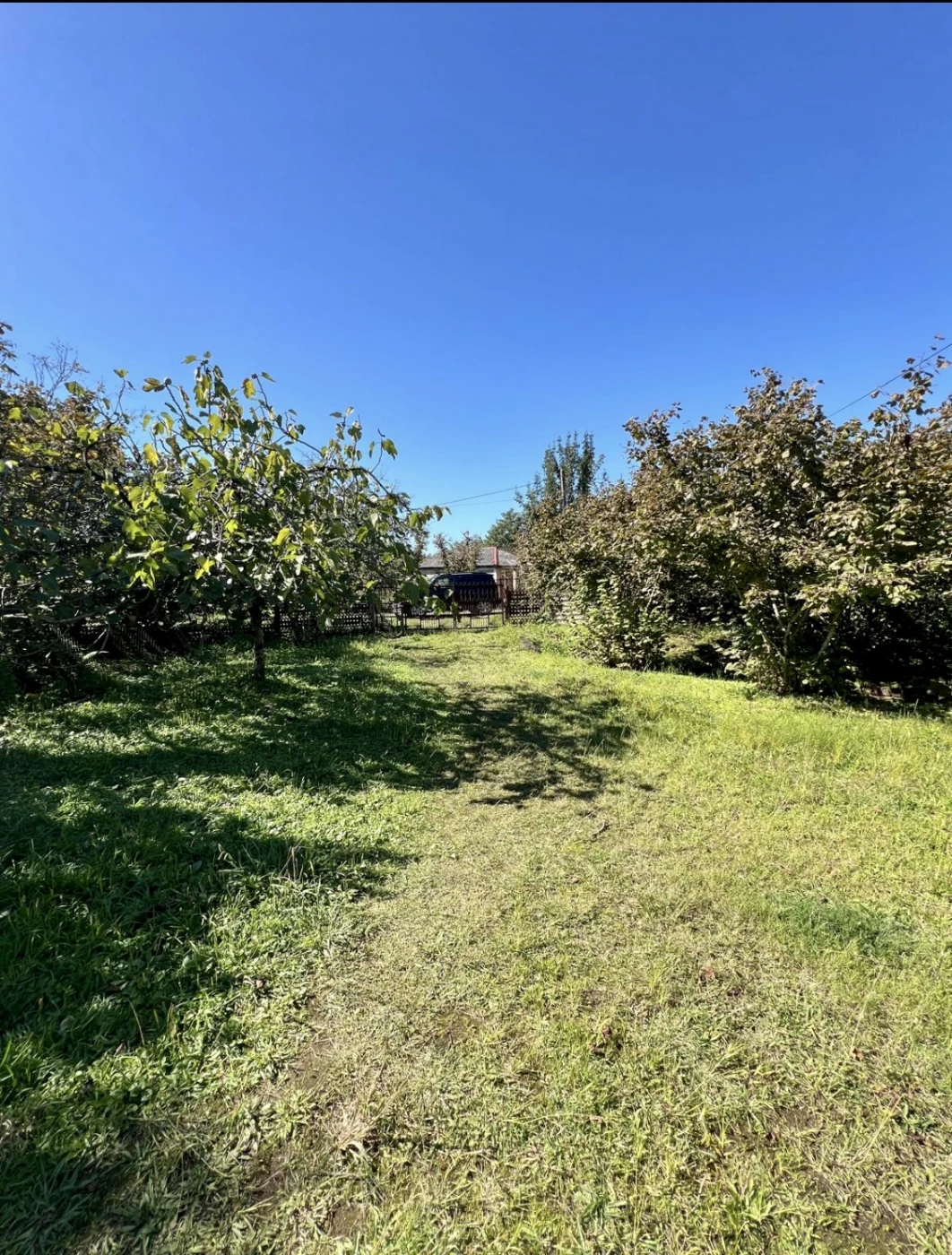 A plot of land , Meria village, with a house